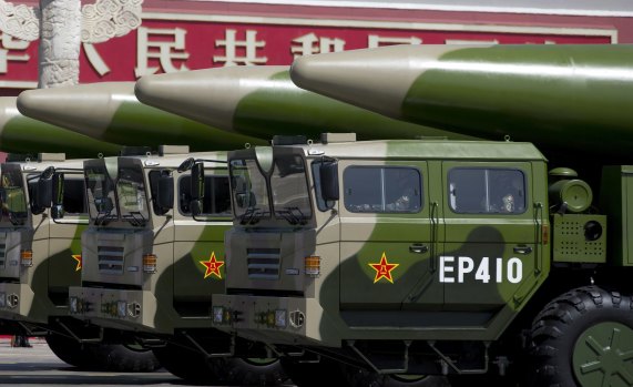 Military vehicles carrying DF-26 ballistic missiles drive past Tiananmen Gate during a military parade in Beijing to commemorate the 70th anniversary of the end of World War II.