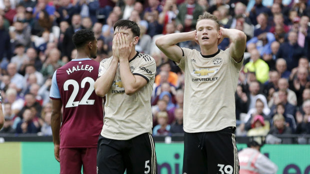 Harry Maguire and Scott McTominay watch the game slip away for Manchester United.
