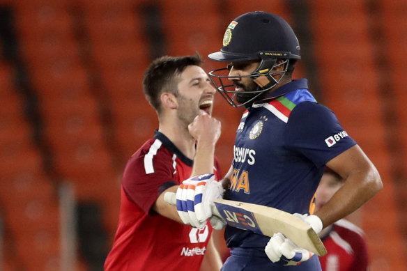 Mark Wood celebrates the wicket of India’s Rohit Sharma.