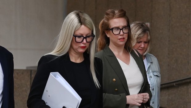 Elaine Stead, centre, and her sister Olivia, right, outside the Federal Court in Sydney on Wednesday.