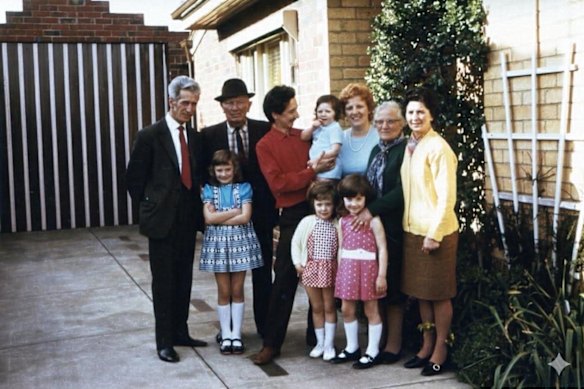 Happy memories: Dante and Rita Alessio, centre, in red and blue tops, with their parents and four daughters - baby Reina, and Alina, Gilda and Sonia - outside their Thornbury home and salon, circa 1972.