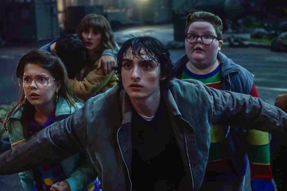 Winona Ryder (back left) as Joyce Byers and Finn Wolfhard as Mike Wheeler (front) lead season five of Stranger Things. 