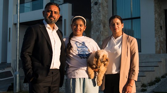 Raj and Aman Mangat with their youngest daughter Iskara and dog Simba in Box Hill.