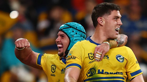 The Eels celebrate against the Broncos.