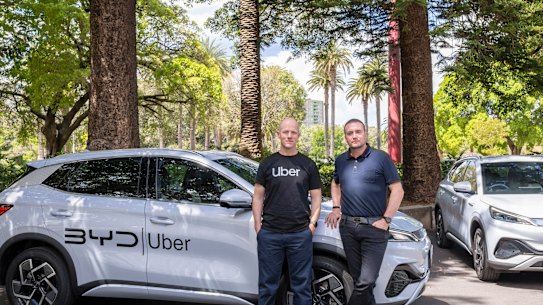 Uber Australia general manager Dom Taylor and EVDirect chief executive Luke Todd with a BYD electric vehicle. 