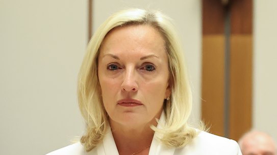 Christine Holgate takes her seat at the start of the Senate hearing on Australia Post at Parliament House.