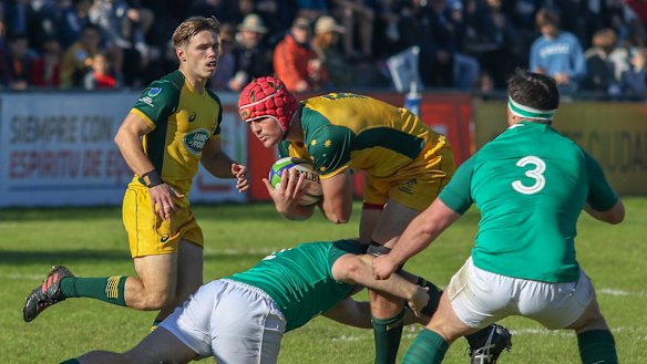 Harry Wilson takes the ball into contact as Will Harrison look on in Australia's 45-17 win over Ireland in the pool stages. 