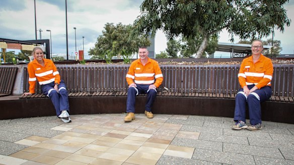 Former Virgin flight attendants Sarah-Rose Sharp and Warren Lock with former Qantas flight attendant Meagan Wise outside Perth Airport.
