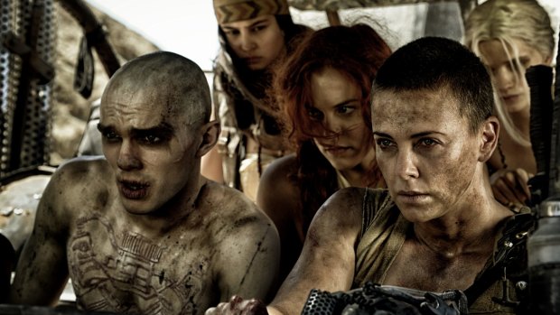 Charlize Theron as Furiosa (front right) driving the War Rig in Mad Max Fury Road.