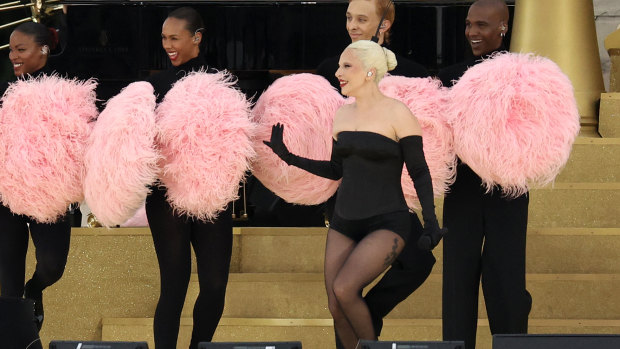 Lady Gaga performs during the athletes’ parade on the River Seine during the opening ceremony.