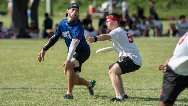 John McNaughton passing the disc during a game of Ultimate Frisbee.