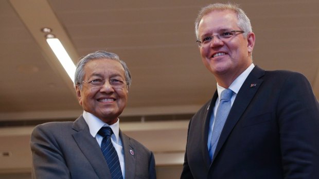 Malaysian Prime Minister Mahathir Mohamad (L) shakes hands with Australian Prime Minister Scott Morrison last month during a bilateral meeting on the sidelines of the Association of Southeast Asian Nations Summit in Singapore.