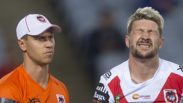 Injury to insult: Gareth Widdop is escorted off the field.