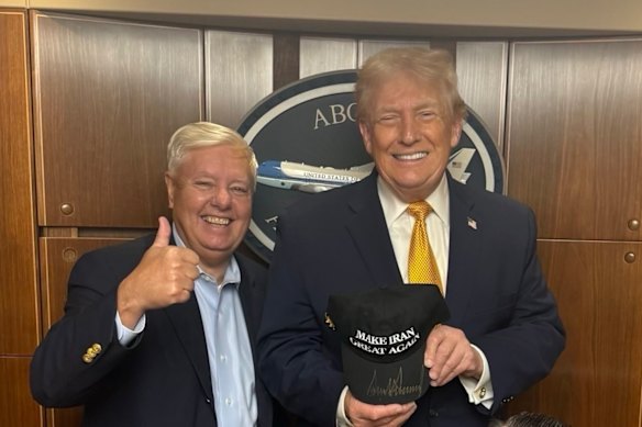 Republican Senator Lindsey Graham meets with President Donald Trump, holding a Make Iran Great Again hat.