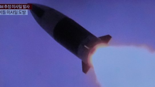 TV screens show a file image of North Korea’s missile launch on a news program in Seoul, South Korea, on Friday.