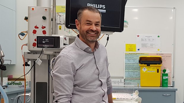 A result to smile about - Chris Gilmour (right) has made a full recovery after being treated by Dr David Rosengren and the RBWH team.