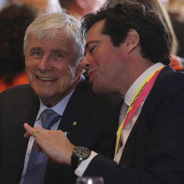 Kerry Stokes and AFL CEO Gillion McLachlan at the 2019 AFL Grand Final function at the MCG. The cancellation of live sports has bitten into Seven's advertising revenue.