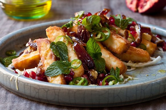 Fried halloumi with white cabbage, date and pomegranate salad.
