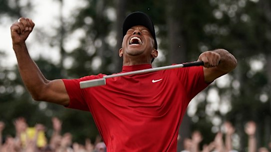 He's done it: Tiger Woods celebrates his fifth Masters title and first major in 11 years.