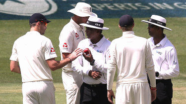 Spirit of game in question: Jimmy Anderson and Joe Root talk with the umpires about ball tampering in the fourth Ashes Test at the MCG in 2017. 