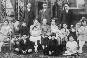 The Greaves and Cumine families in Shanghai, October 1923, with baby Bea in her mother's lap (middle row, fourth from left).