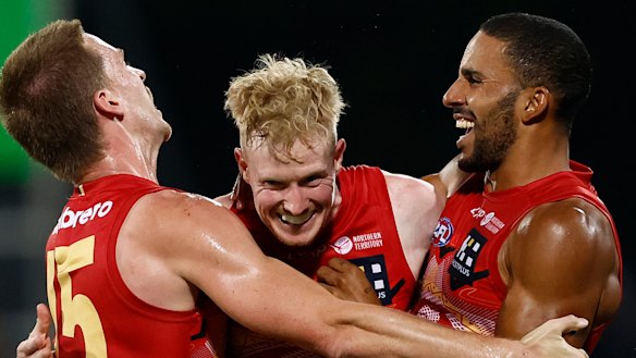 Noah Anderson, John Noble and Touk Miller celebrate.