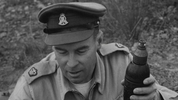 File photo of Major C. Morton in 1957, preparing shells that army ammunition experts collected in Sydney during an appeal for residents to hand in any military ammunition and explosive "souvenirs" in their homes.