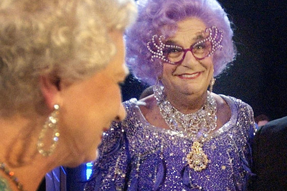 Britain’s Queen Elizabeth II, left, meets Dame Edna Everage, at the Festival Theatre in Edinburgh for the start of the 75th Royal Variety performance, Monday Nov. 24, 2003.