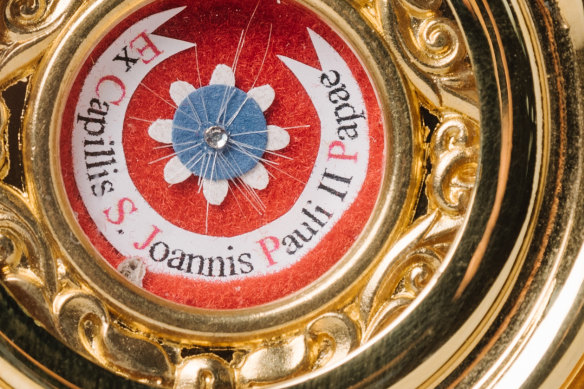 A close up of the hair from Saint John Paul II arranged in a star.