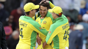 Nathan Coulter-Nile, second right, became the highest scoring lower-order batsman in World Cup history.