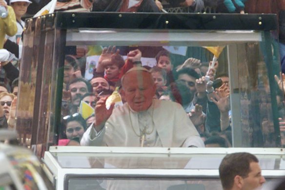 Pope John Paul II, pictured in his famous popemobile.