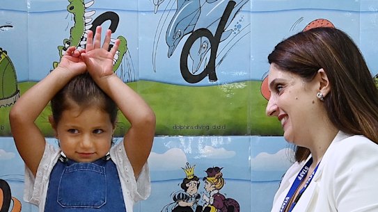 Smart Start’s Michelle Tamaro practices the alphabet with Gabriella Ndaira, 4.