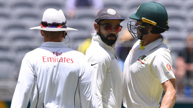 Heated: Australia and India's captains engage in some on-field niceties. 