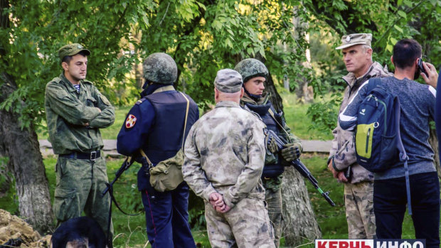 Police at the vocational college in Kerch, Crimea, after the shooting.