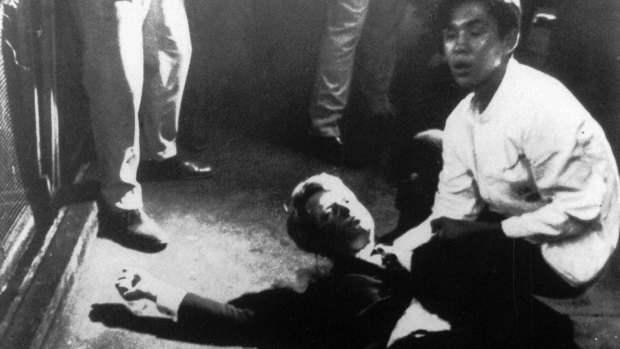 Juan Romero comforts Robert Kennedy after the shooting, having put rosary beads in his hand.