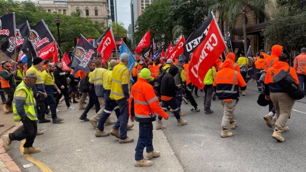 CFMEU workers march through Brisbane streets to protest safety concerns at Cross River Rail  worksites.