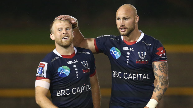Rebels pair Billy Meakes and Andrew Deegan celebrate victory at Leichhardt Oval.