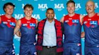 Owner and chief executive of MA Services Group, Mick Ahuja with Melbourne Demons players. Source: Melbourne Football Club