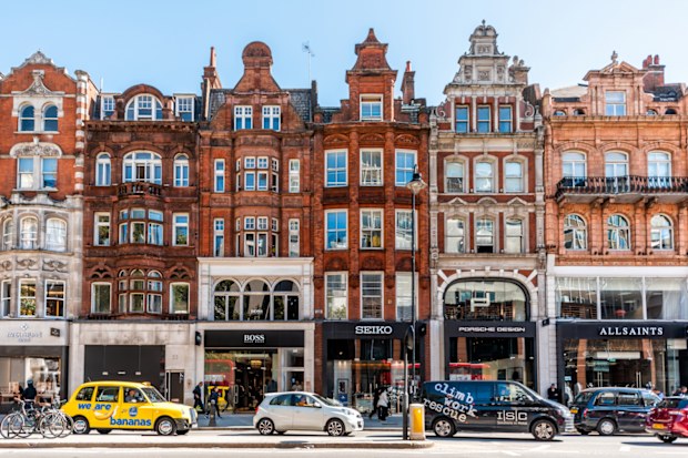 Neighbourhood district of Knightsbridge brick architecture, road, cars in street traffic on sunny day