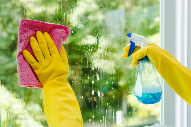 Window glass cleaned with spray and cloth