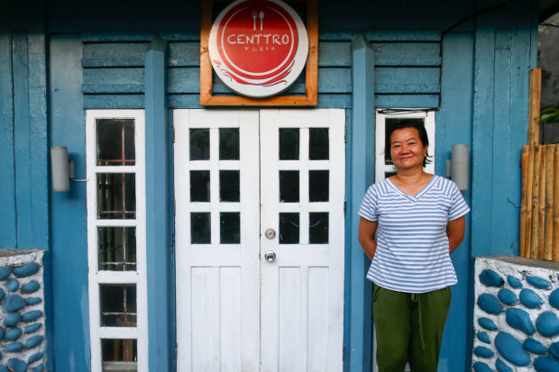 Jeanette “Jinky” Cabardo in front of her cafe in Basco.