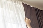 Thick curtains kept closed on cold nights or when you're using the heater keeps heat in.