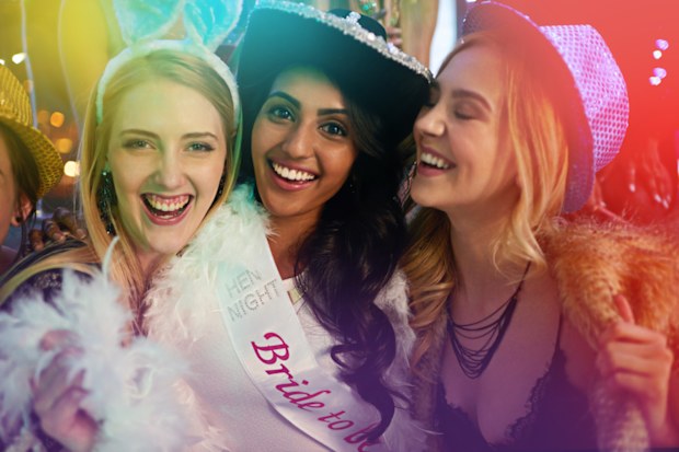 Portrait of a group of young woman having a bachelorette party at a nightclub