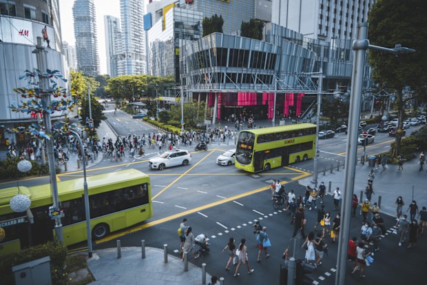 The Orchard Road crossing in Singapore is one of the busiest in the world, here seen an afternoon during the Covid-19 corona pandemics in October 2020. All people wearing masks to protect themselves.