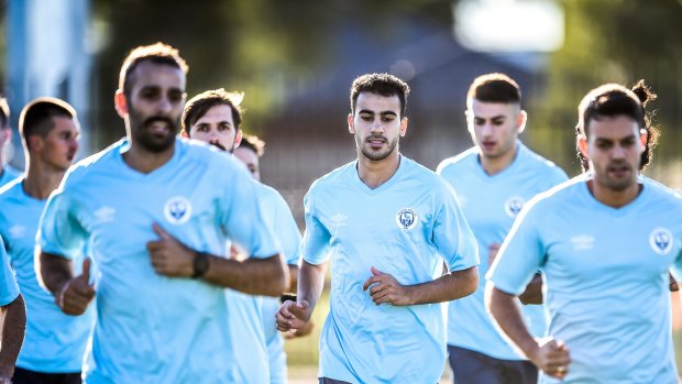 A-League dream: Hakeem al-Araibi (centre) trains with his Pascoe Vale teammates.