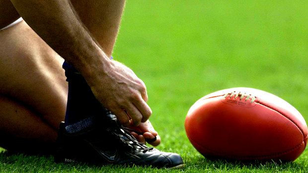 An amateur footballer was suspended after racially abusing an opposition player.