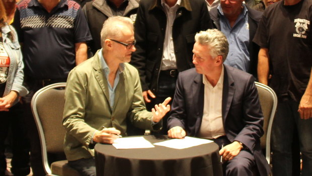 Coles director John Durkan and TWU national secretary Tony Sheldon have signed two agreements to ensure safe and fair conditions for gig-economy and transport workers in the Coles supply chain.