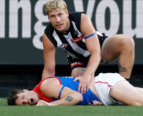Collingwood’s Billy Frampton comforts opponent Brody Mihocek.
