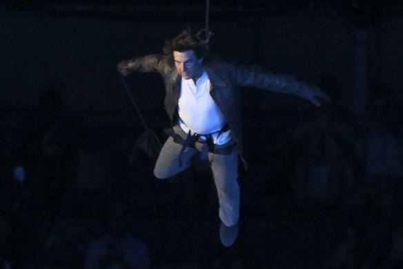 Tim Cruise rappels into Stade de France for the closing ceremony.