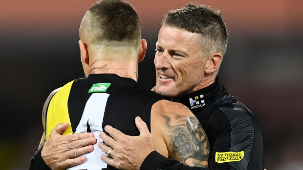 Damien Hardwick embraces Dustin Martin after the grand final